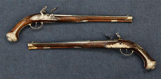 A pair of 18th century Bavarian flintlock holster pistols by Johann Jacob Kuchenreuter, overall length 21.5in.